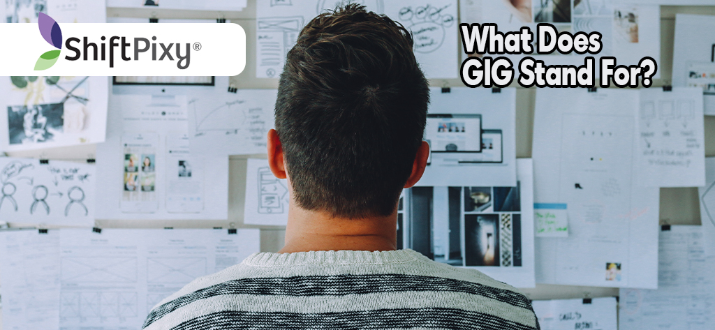 Man staring at a poster board with many descriptions of GIG